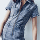 Combinaison zippée en denim avec manches courtes et poches pour femmes