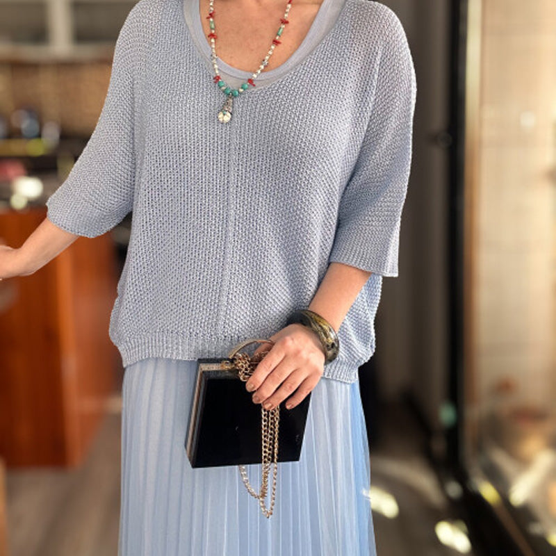 Ensemble chic composé d'une robe gilet et d'un haut cache-cœur